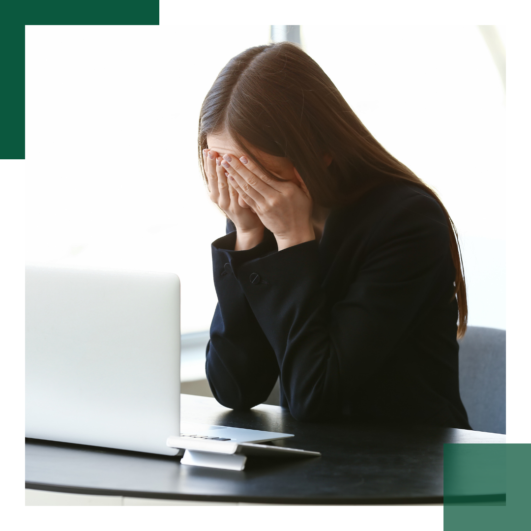 Woman upset at her desk